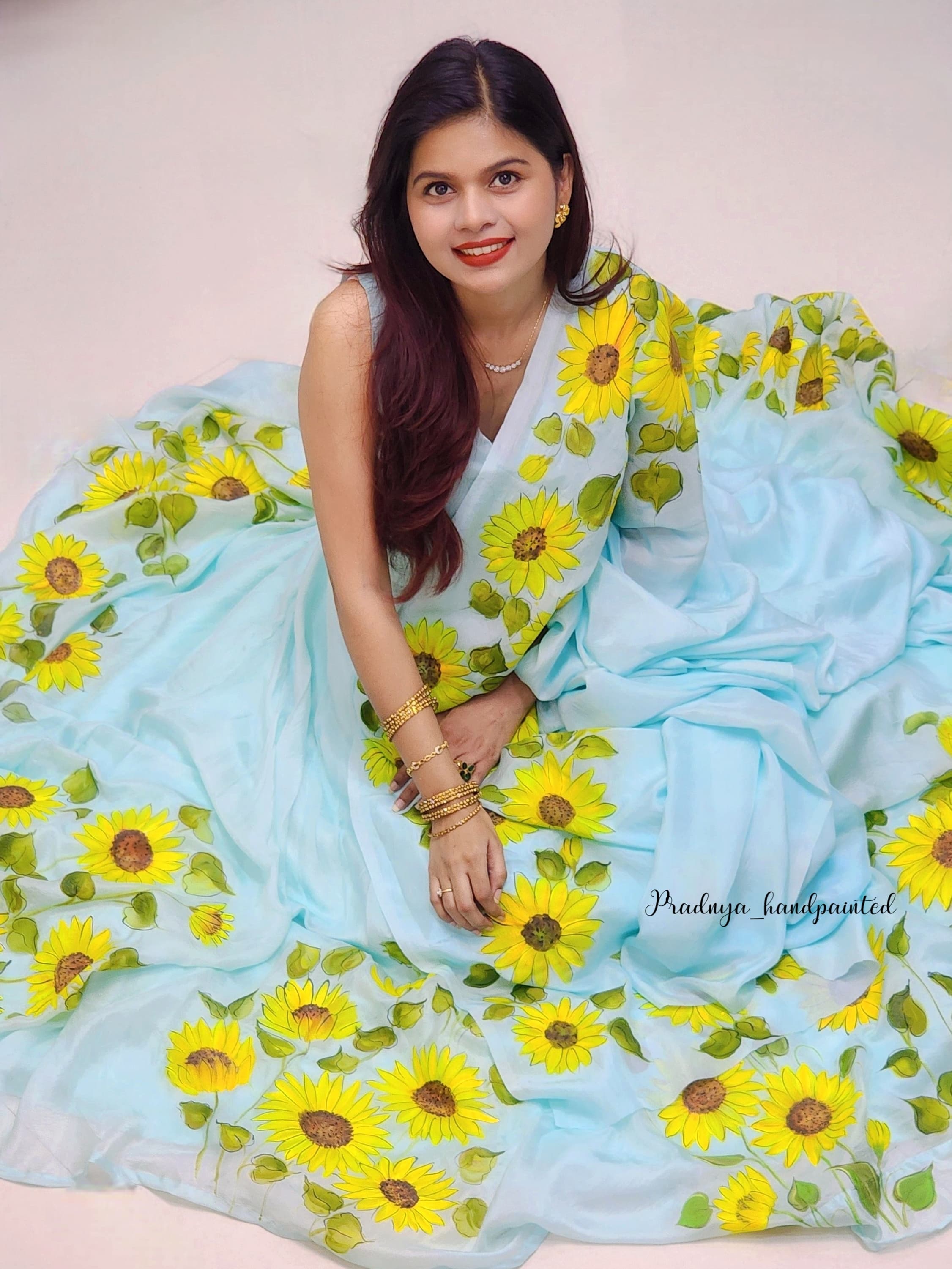 Sunshine on Silk – Hand-Painted Pure Silk Lehenga with Sunflower Floral Design (Mint Green)